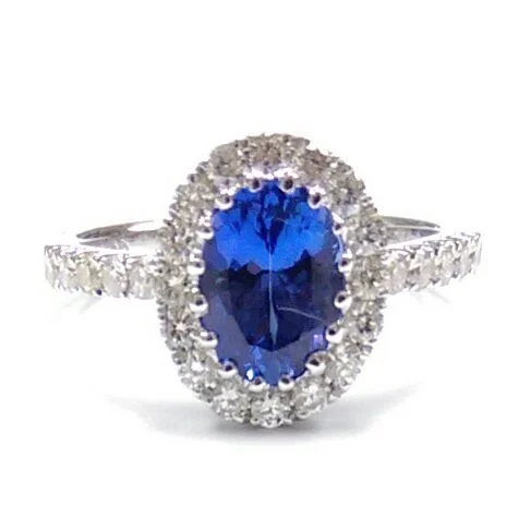 women's engagement rings with modern aesthetic -6X8MM Oval Tanzanite and Diamond Halo Ring in 14KT White Gold