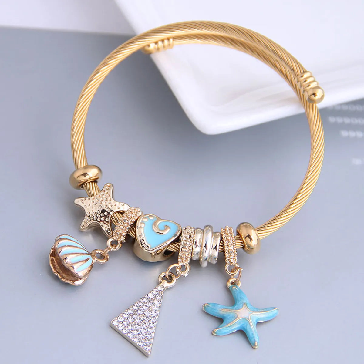 women's bracelets with silver-plated finish -Fashion Metal Wild Pan Dl Starfish Seashell Triangle Pendant Multi-Element Accessories Bracelet Nihaojewelry Wholesale Bracelet