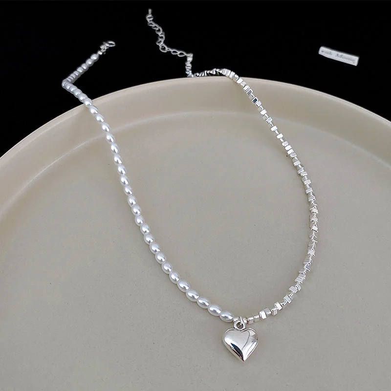 Love Pearl Broken Silver Necklace.